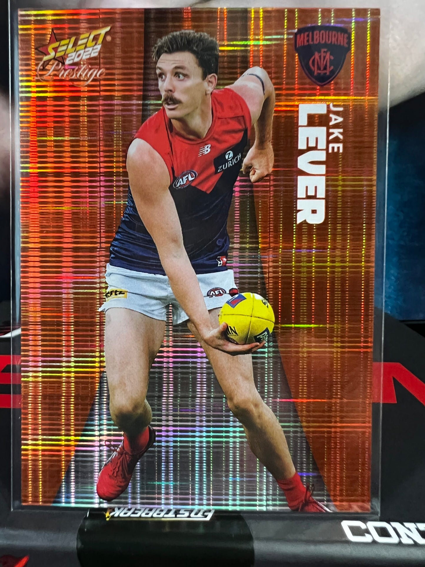 Jake Lever - Melbourne - 2022 - Footy Stars Prestige - Orange Parallel - 28/210